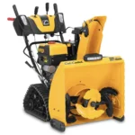 Cub Cadet 3X 26 inch TRAC IntelliPower snow blower on sloped driveway