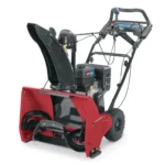 Toro SnowMaster 724 QXE gas snow blower clearing driveway
