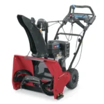 Toro SnowMaster 824 QXE gas snow blower clearing driveway